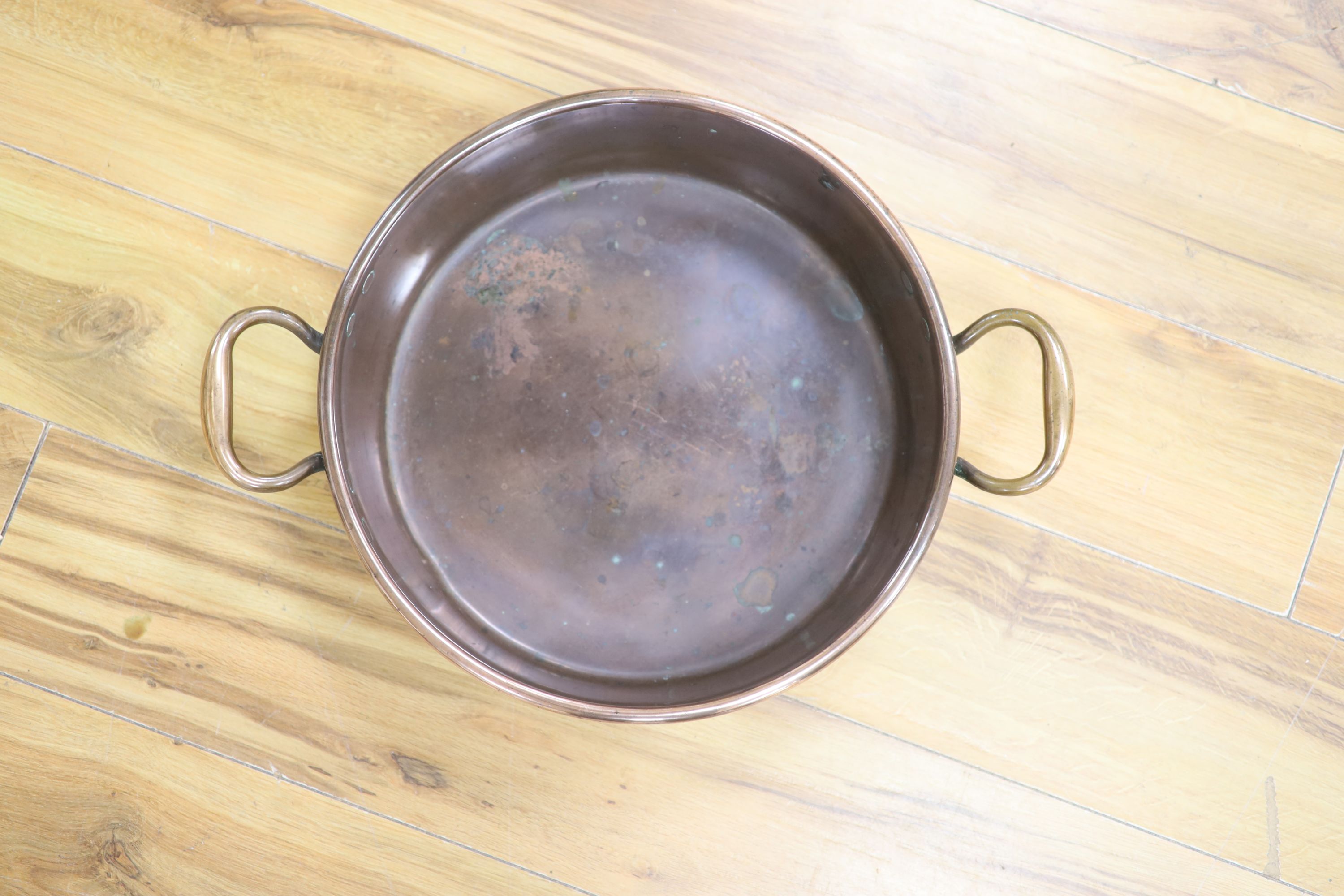 A Victorian copper preserve pan, stamped Benet Fink and Co., Cheapside, 51cm handle to handle